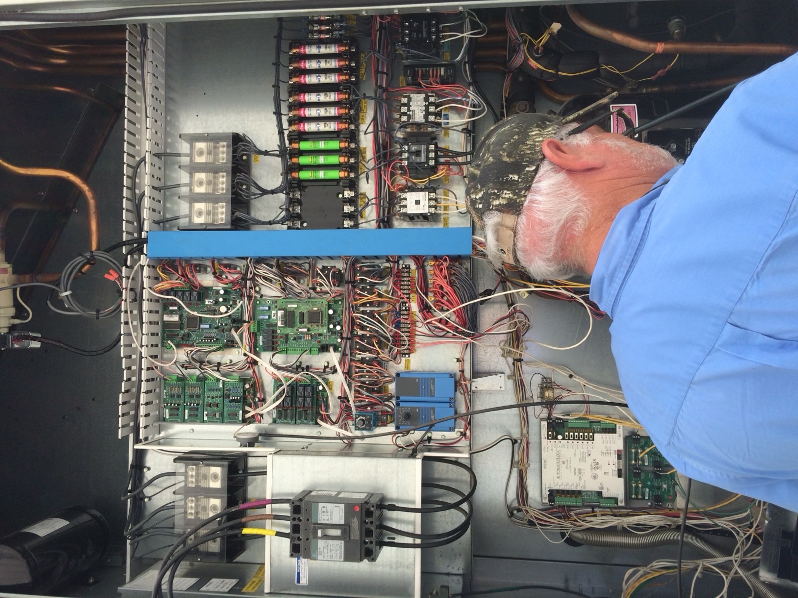 MD Air technician working on commercial HVAC control panel